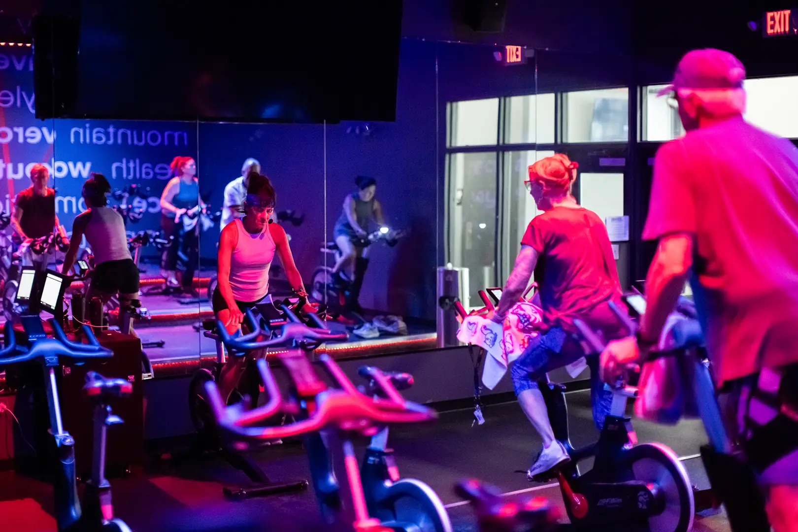 Another group of people in a cycling class.