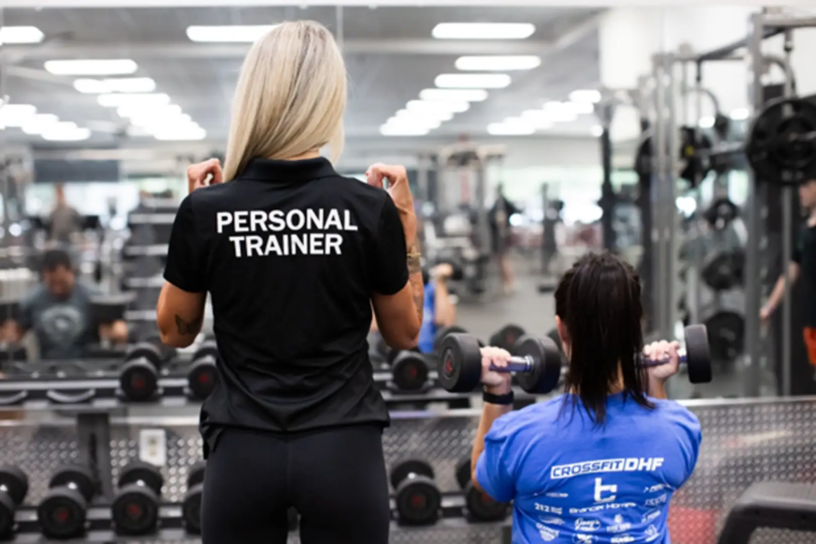 Female personal trainer working with a female client.